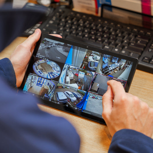 Checking CCTV camera on tablet